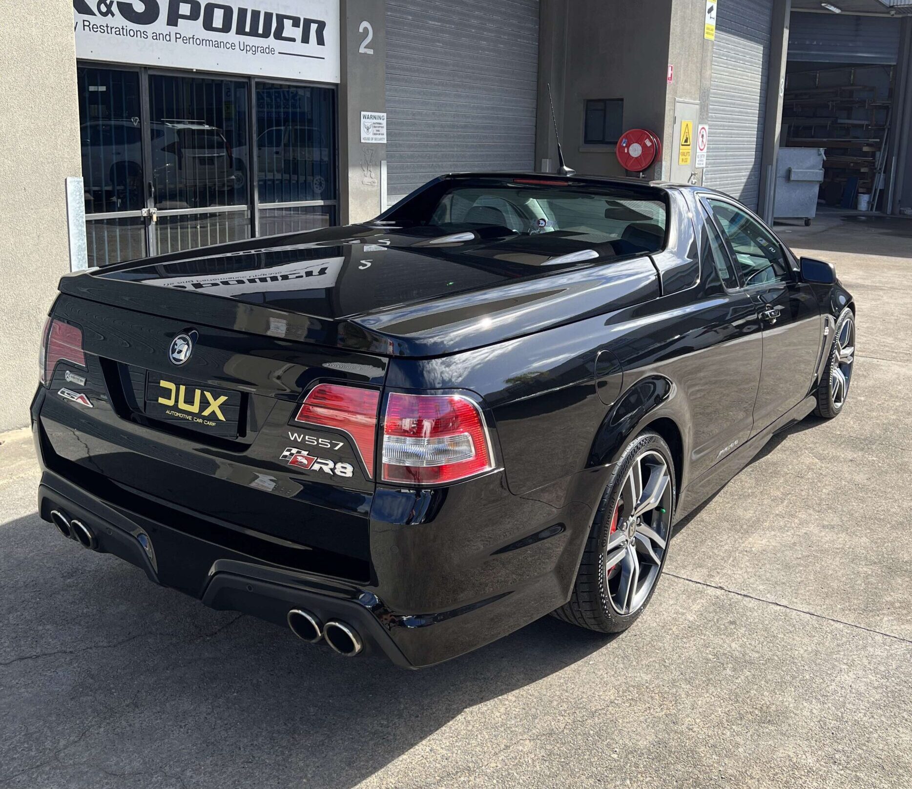 Final inspection under high-intensity lighting - Dux Car Care studio Nerang