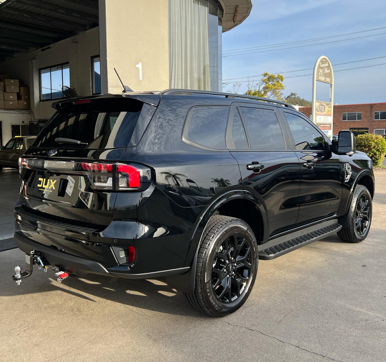 Dealership ceramic coating vs independent studio Gold Coast — Dux Car Care